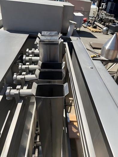 Multiple gravity feed chutes for lane-by-lane lemon loading